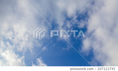 White clouds flowing in the afternoon blue sky White clouds flowing in the afternoon blue sky 107121745