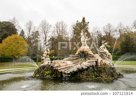 A fountain decorated with various stone structures under a cloudy sky at the National Trust's Cliveden on the outskirts of London 107121814