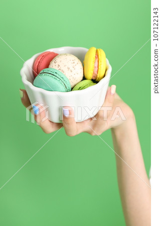 Hand with Macaroons 107122143