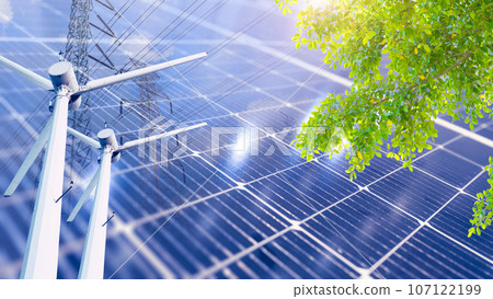 Clean carbon free and sustainability energy power production technology concept. Solar panel overlay wind turbine and power line with green plant tree. 107122199