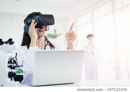 Student using VR glasses headset technology for help visual learning education science class room in modern school Student using VR glasses headset technology for help visual learning education science class room in modern school 107122245