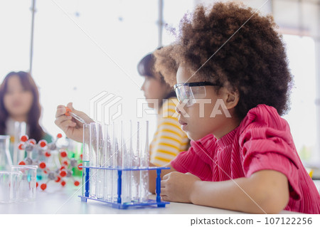 Afro black kid diversity children playing in science chemical lab for learning education in school with friend Afro black kid diversity children playing in science chemical lab for learning education in school with friend 107122256