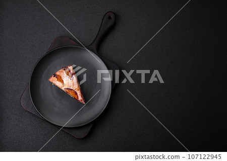 Delicious sweet aromatic homemade pie with ripe plums Delicious sweet aromatic homemade pie with ripe plums 107122945