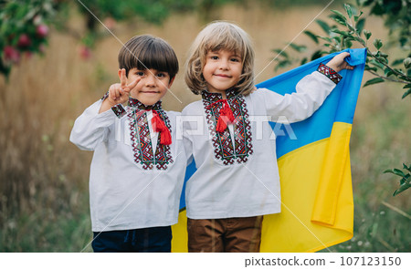 Handsome happy boys, ukrainian patriots 4 years old children with national flag Handsome happy boys, ukrainian patriots 4 years old children with national flag 107123150