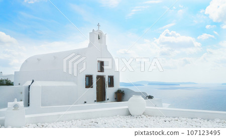 White church. Traditional architecture on Santorini island, Greece. Beautiful summer landscape. White church. Traditional architecture on Santorini island, Greece. Beautiful summer landscape. 107123495