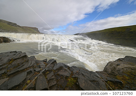 Gullfoss - Golden Falls - on Iceland's Golden Circle route under autumn clouds. 107123760
