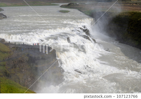 Gullfoss - Golden Falls - on Iceland's Golden Circle route under autumn clouds. Gullfoss - Golden Falls - on Iceland's Golden Circle route under autumn clouds. 107123766