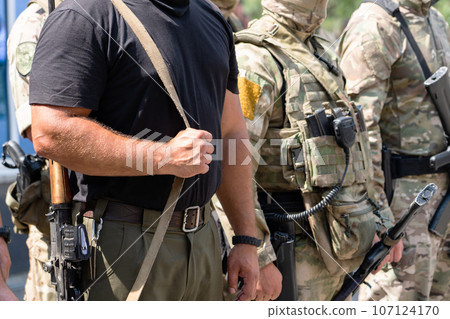 Soldiers stand in line in hollow military gear. military operation. Soldiers stand in line in hollow military gear. military operation. 107124170
