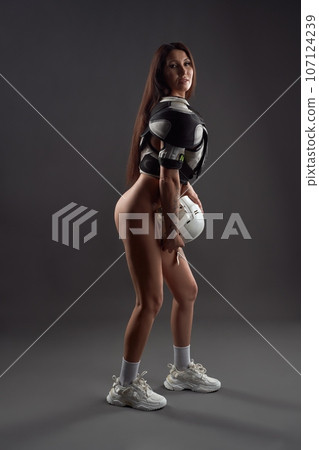 Alluring naked woman in hockey player uniform Alluring naked woman in hockey player uniform 107124239