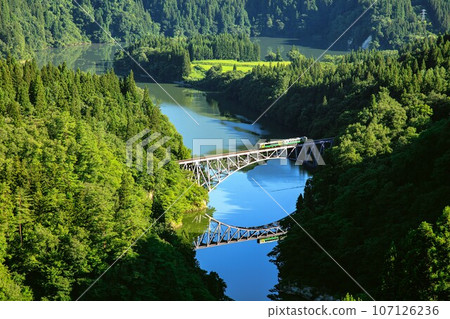 Tadami Line Summer train crossing the Daiichi Tadami River Bridge (Mishima Town, Fukushima Prefecture, early morning in mid-August) Tadami Line Summer train crossing the Daiichi Tadami River Bridge (Mishima Town, Fukushima Prefecture, early morning in mid-August) 107126236