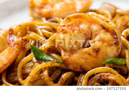 A close-up of yakisoba (fried noodles with shrimp sauce). A close-up of yakisoba (fried noodles with shrimp sauce). 107127350