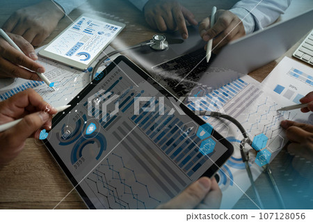Insurance Healthcare Doctor analyzing medical report and medical on hospital background 107128056