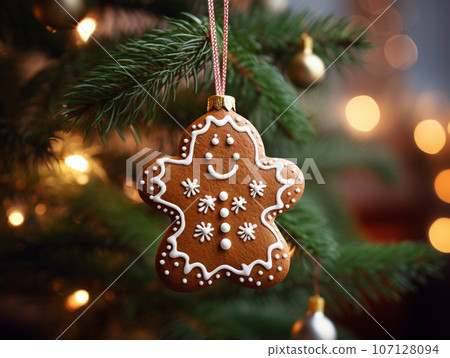 gingerbread with icing hanging on the Christmas tree. High quality photo gingerbread with icing hanging on the Christmas tree. High quality photo 107128094