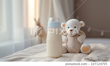 baby food, milk or formula for the baby against the background of a cozy baby room. High quality photo 107128705