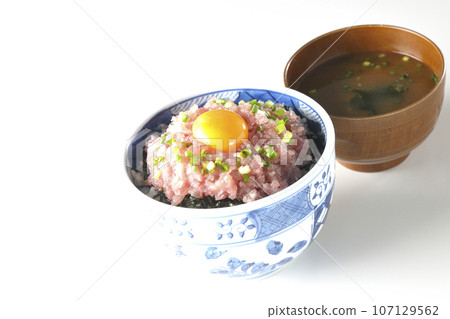 Seared tuna bowl with green onion and egg yolk and miso soup 107129562