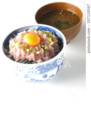 Seared tuna bowl with green onion and egg yolk and miso soup 107129567