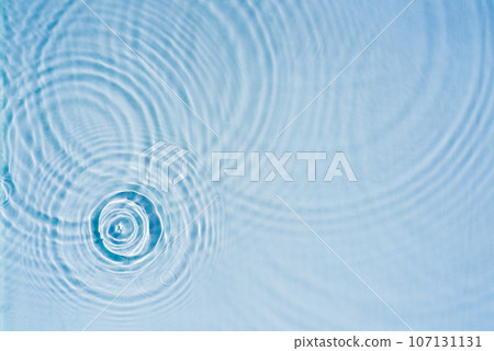 Beautiful pattern of circles of drops on background of water Beautiful pattern of circles of drops on background of water 107131131