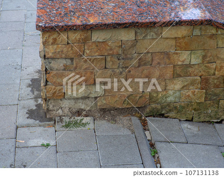 Sand stone wall surface, background of decorate. Broken tile wall 107131138