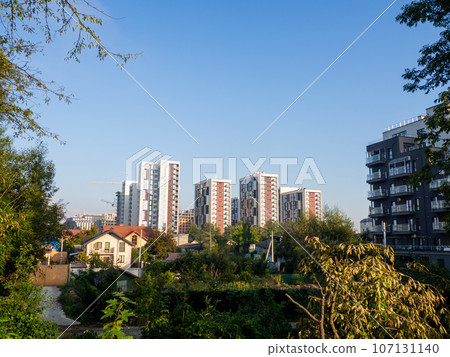 New modern residential apartment buildings district surrounded by green park 107131140