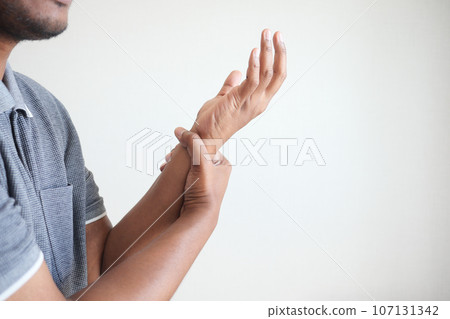 man suffering pain in hand close up man suffering pain in hand close up 107131342