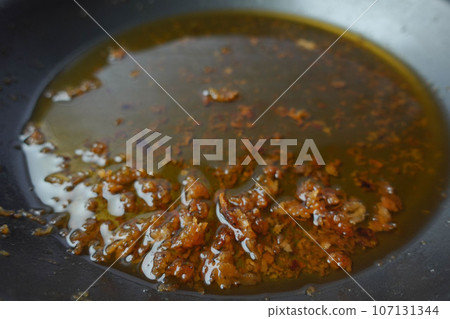 Used vegetable oil in a plate . Used vegetable oil in a plate . 107131344