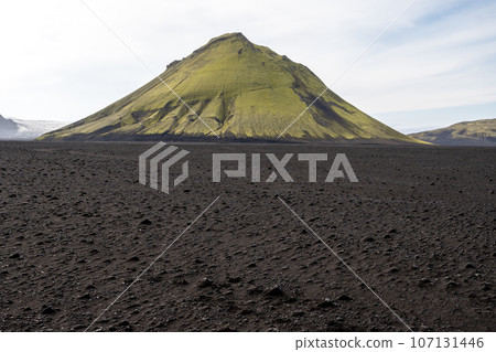 Maelifell volcano in black lava fields of Fjallabak Nature Reserve in Iceland. 107131446