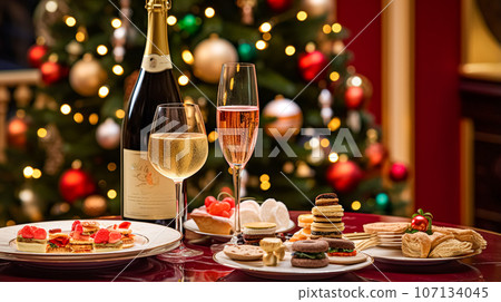 Christmas holidays and New Year celebration, dinner table at a luxury English styled restaurant or hotel, wine, appetisers and Christmas tree decoration, holiday party and event invitation Christmas holidays and New Year celebration, dinner table at a luxury English styled restaurant or hotel, wine, appetisers and Christmas tree decoration, holiday party and event invitation 107134045