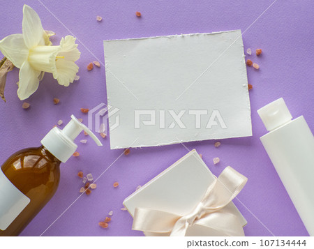 daffodils flower, bottles, gift box and paper card with copy space daffodils flower, bottles, gift box and paper card with copy space 107134444
