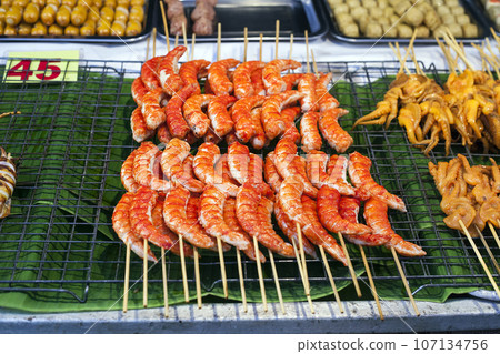 Grilled Large Shrimps on sticks, street market Grilled Large Shrimps on sticks, street market 107134756