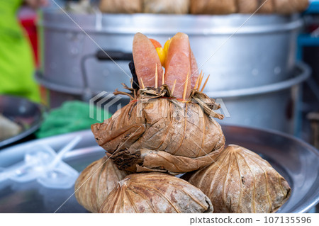 Zongzi or Ba Jang, product samples placed in stainless steel plates for customers to see. 107135596