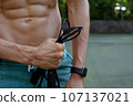 a man doing with rubber bands 107137021