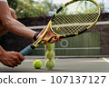 close-up. male hands holding tennis racket and balls 107137127