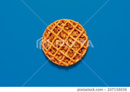 Apple pie homemade, above view on a blue table 107138036