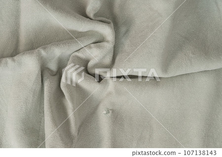 Texture of lused ight gray organic linen fabric closeup 107138143