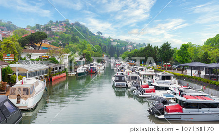 Group of boats docked in Goksu Stream, beside Anadolu Hisari historic castle on the Asian side of Istanbul, Turkey 107138170