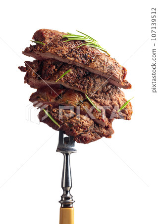 Grilled beef steak with rosemary isolated on a white background. 107139512