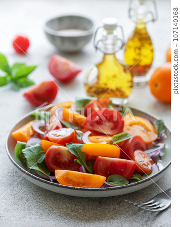 Green salad from leaves and tomatoes Green salad from leaves and tomatoes 107140168