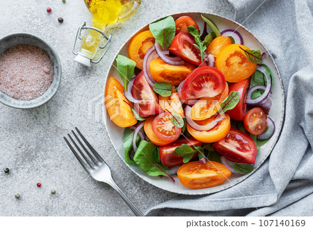 Green salad from leaves and tomatoes Green salad from leaves and tomatoes 107140169