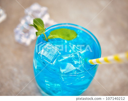 blue lemonade in a glass with ice blue lemonade in a glass with ice 107140212