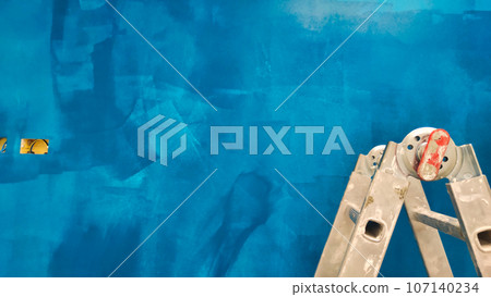 ladder on the background of a blue wall ladder on the background of a blue wall 107140234