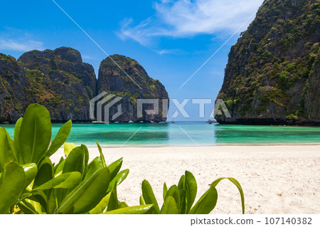 The legendary Maya Bay beach without people where the film "beach" with Leonardo DiCaprio was filmed with a beautiful bay of sand and clear turquoise water. UNESCO World Heritage. 107140382
