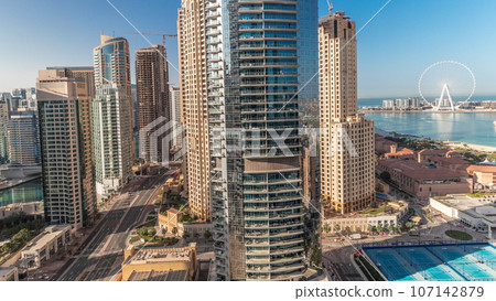 Panoramic view of the Dubai Marina and JBR area and the famous Ferris Wheel aerial Panoramic view of the Dubai Marina and JBR area and the famous Ferris Wheel aerial 107142879
