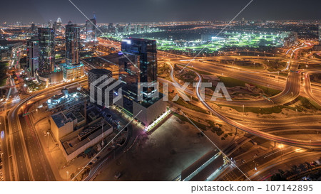 Panorama showing Dubai marina and JLT skyscrapers along Sheikh Zayed Road aerial night. 107142895