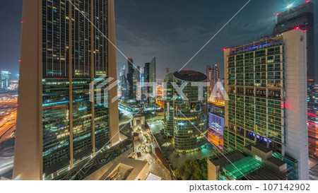 Dubai international financial center skyscrapers aerial all night. 107142902