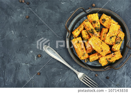 Corn cobs grilled or baked. Corn cobs grilled or baked. 107143838
