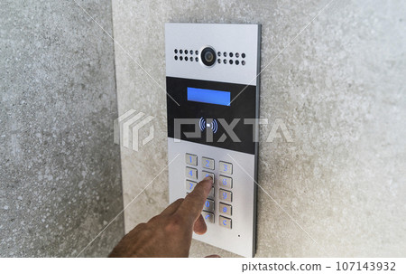 Intercom on door house. Electronic key and video call for entry. 107143932