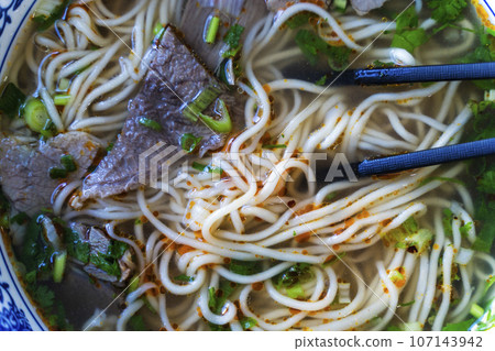 Chinese noodle soup. Asian style ramen noodles with beef and broth. Chinese Asian cuisine 107143942