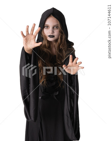 Little girl in Halloween witch costume Little girl in Halloween witch costume 107144611
