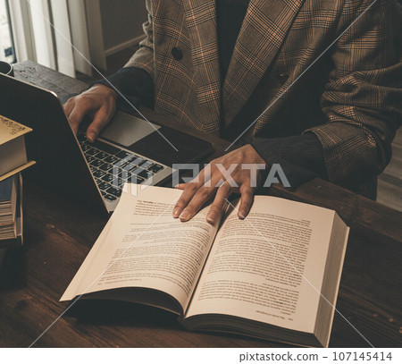 A woman teleworking in a stylish room 107145414