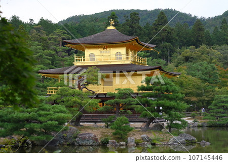 Kinkakuji Temple is a popular tourist destination in Kyoto with its beautiful surrounding pine trees. Kinkakuji Temple is a popular tourist destination in Kyoto with its beautiful surrounding pine trees. 107145446